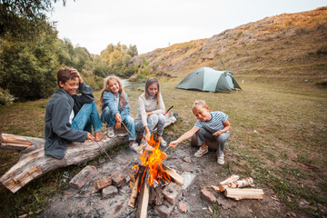 Children in the camp by the fire