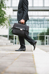 Wall Mural - Anonymous businessman commuting in the city.