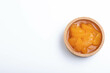 © mangolovemom - Pickled peeled oranges in syrup in a cup.on a white background.