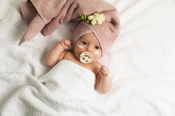 cute little baby with cream on face, top view