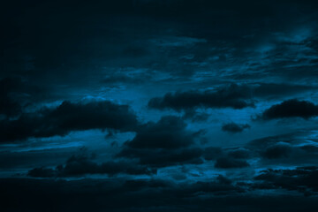 Wall Mural - dark blue green sky with clouds. dramatic night sky. moonlight. toned background with space for desi