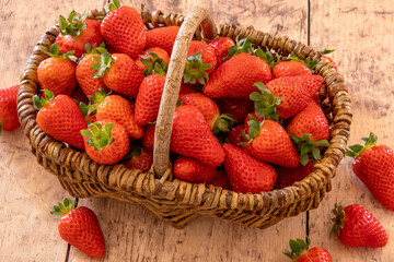 Wall Mural - top view of ripe strawberries in a basket