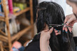 © STOCKEROcr - Unknown hairdresser cutting a woman's hair for donation