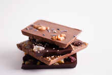 Assorted Chocolate Bars With Fruit, Nuts And Spices; Stacked.
