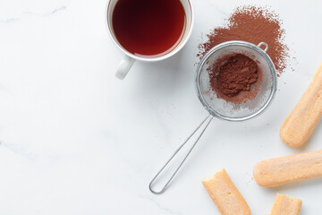 Wall Mural - Tiramisu ingredients: Italian cookie savoiardi, coffee and cocoa powder