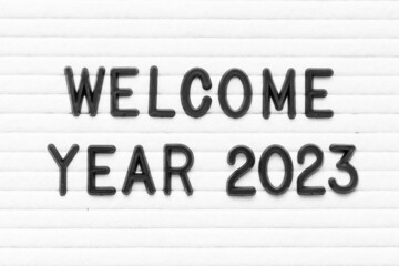 Canvas Print - Black color letter in word welcome year 2023 on white felt board background