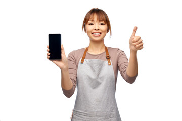 cooking, technology and people concept - happy smiling female chef or waitress in apron showing smartphone with empty screen over white background