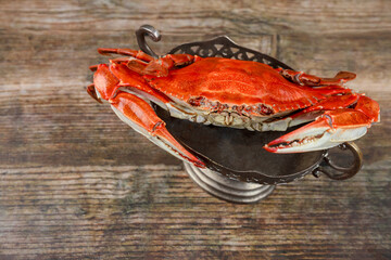 Wall Mural - Steamed red crab on wooden background. Seafood.