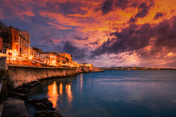 Long exposure of Ortigia with spectacular sunset over the sea