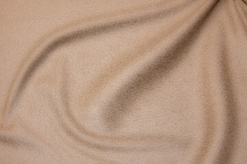 Wall Mural - Close-up texture of natural beige fabric or cloth in brown color. Fabric texture of natural cotton or linen textile material. Beige canvas background.