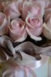 A beautiful bouquet of pink roses in a box.
