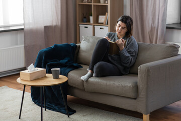 Wall Mural - people, leisure and depression concept - sad woman with diary sitting on sofa at home