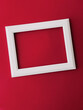 Leinwandbild Motiv White horizontal art frame on red background as flatlay design, artwork print or photo album