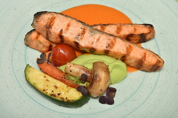 Sticker - salmon fillet with aromatic sauce , mushroom and avocado sauce