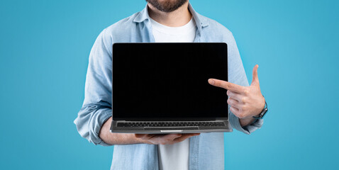 Poster - Cropped of man holding laptop computer with empty screen
