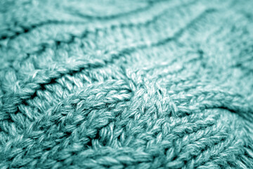 Wall Mural - Warm knitting texture with blur effect in cyan tone.