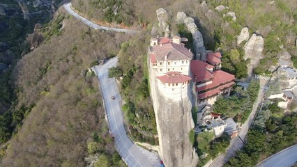 Wall Mural - 4k cinematic aerial video of medieval monasteries on top of impressive rock formations at Meteora, Greece