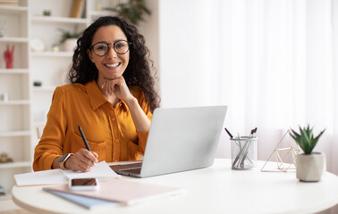 Poster - Happy Brunette Business Lady Using Laptop Posing Sitting In Office