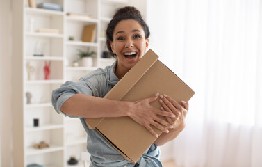 Wall Mural - Joyful Lady Customer Holding Cardboard Standing At Home