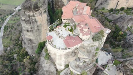 Wall Mural - 4k cinematic aerial video of medieval monasteries on top of impressive rock formations at Meteora, Greece