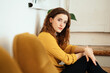 © contrastwerkstatt - young woman with yellow blouse looks thoughtfully melancholic into camera