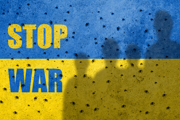 Flag of Ukraine painted on a concrete wall with word STOP WAR . Russian military aggression