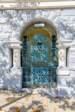 Arched Blue Metal Gate With Pillars On Both Sides In San Francisco, California