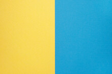 Two Colored Papers With A Blue And Yellow Overlay On The Floor. They Divide Half Of The Image. . High Quality Photo