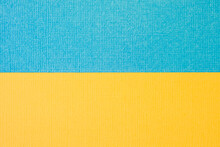 Textured Two-tone Paper Background In Yellow And Blue. Dual Background, Flat Lay. High Quality Photo