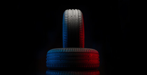 Wall Mural - New car tires. Group of road wheels on dark background. Summer Tires with asymmetric tread design. Driving car concept.