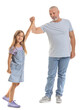 © Pixel-Shot - Little girl with her grandfather holding hands on white background