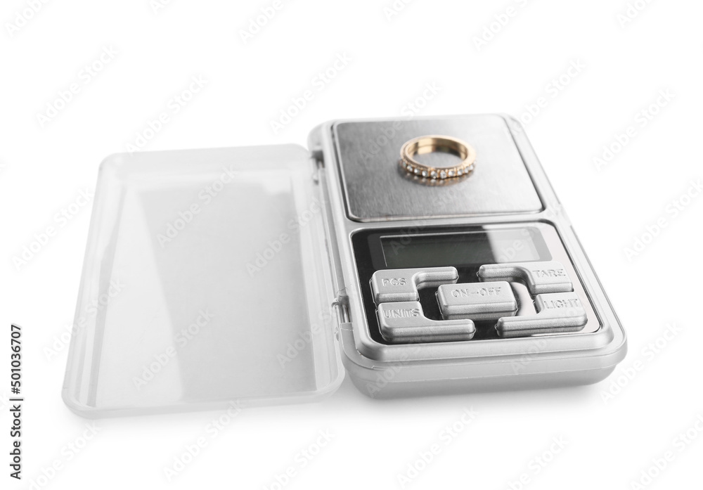 Jewelry scales with ring on white background