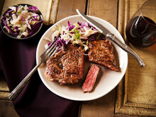 Grass Fed Rib-Eye Steak With Slaw And Red Wine; On A Plate; From Above