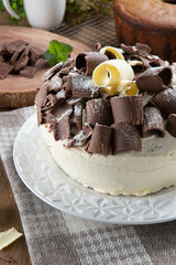 Wall Mural - White chocolate and dark chocolate cake two loves on wooden table. Birthday and wedding cake