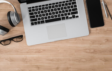 Wall Mural - Laptop, smartphone and other devices on wood office desk, copy space, 3d rendering
