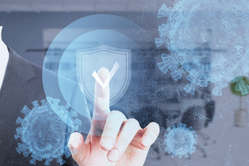 Close up of businessman hand pointing at antivirus protection shield on blurry background. Cyber attack and insurance concept. Double exposure.