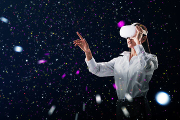 Aufkleber - Abstract double exposure image of attractive young white european woman with VR glasses pointing at starry sky space background. Metaverse, future and wearable device concept.