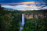 Fototapeta Las - Flowing River in Fitzroy water Falls in Bowral NSW Australia beautiful colourful cloudy skies lovely waterfalls