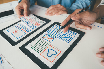 Creative Web Designer planning application and developing template layout, framework for mobile phone. User experience (UX) concept.