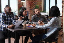 Multiethnic Executive Managers Interviewing African American Applicant Discussing Cv Resume Recruiting Employer For Human Resources Job In Startup Company Office. Concept Of Hiring Process