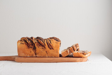 Wall Mural - Sweet swirl homemade bread with poppy seeds