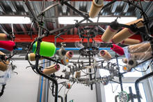 Closeup Details Of Industrial Socks Knitting Machine On Hosiery Factory.