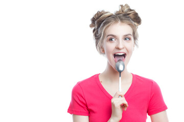 Food Ideas. Funny Winsome Caucasian Blond Girl in Red T-Shirt With Shiny Metal Spoon in Front of The Mouth Over Isolated Pure White Background