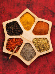 Wall Mural - Spices, herbs, spicy and seasoning in a wooden box top view.