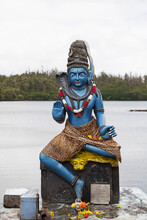 Statue Of Vishnu, The Hindu God With Cobra And Wearing A Leopardskin, In Human Form As Krishna, At Ganga Talao, Mauritius, Indian Ocean