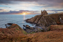 Ruins Of Dunskey Castle On Rugged Coastline At Sunset, Portpatrick, Dumfries And Galloway, Scotland