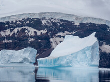Icebergs Surround The Glacier Covered Volcano Called Peter I Island In The Bellingshausen Sea