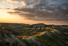 Sunset Above Badlands And Countryside With Colored Clouds In The Sky, Bologna, Emilia Romagna