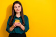 © deagreez - Photo of sweet dreamy woman wear green shirt chatting modern device empty space isolated yellow color background