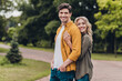 © deagreez - Portrait of attractive cheerful amorous couple spouses hugging cuddling enjoying honey moon trip outdoors